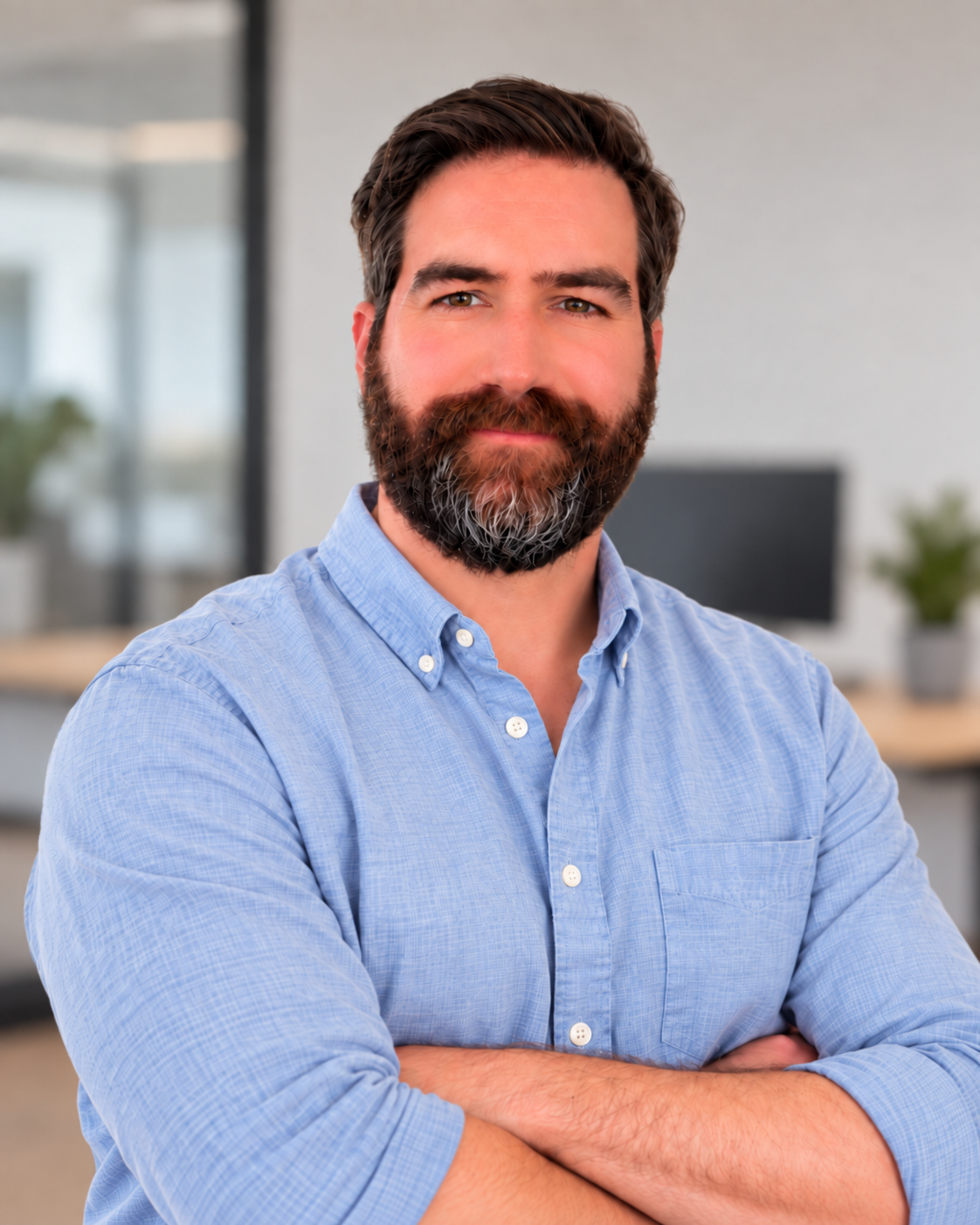 Josh Willis, founder of Time2Breathe, in a light blue shirt with arms crossed